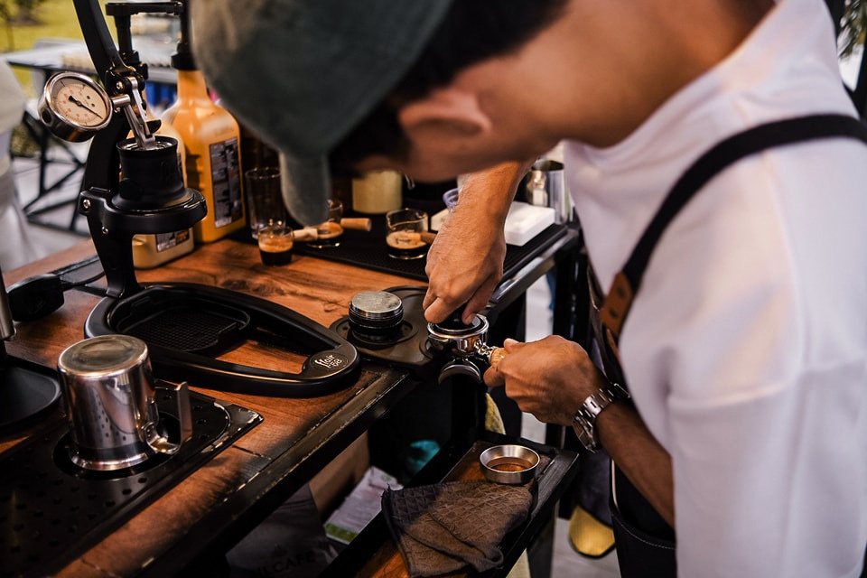 Island Street Coffee barista preparing an espresso at the coffee bar